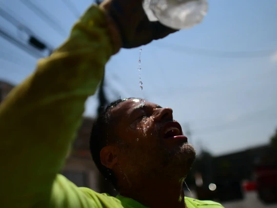 man pouring water on face